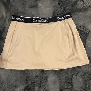 Calvin Klein Performance skort. In a size XL in the color tan
